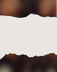 a torn piece of paper with a picture of a group of people